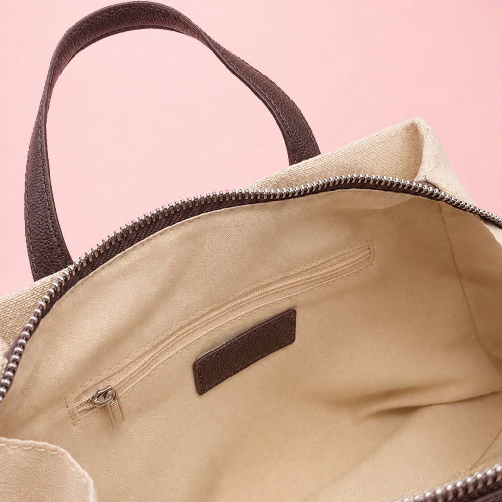 Open interior view of linen tote bag showing zip and slip pockets