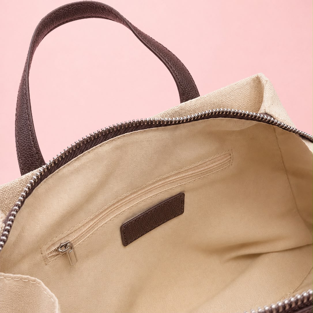 Open interior view of linen tote bag showing zip and slip pockets