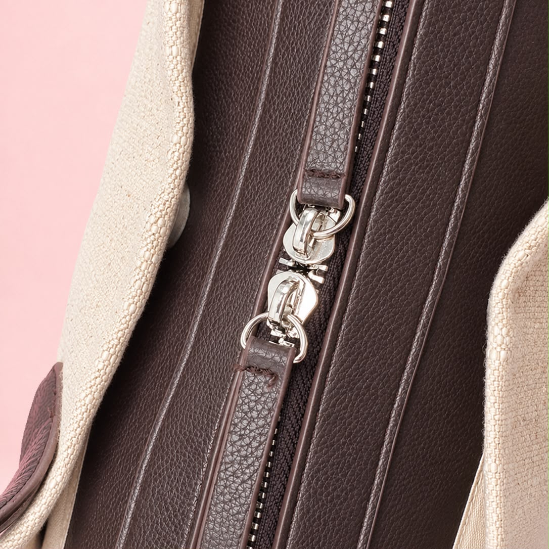 Double zipper pull hardware detail on linen tote bag
