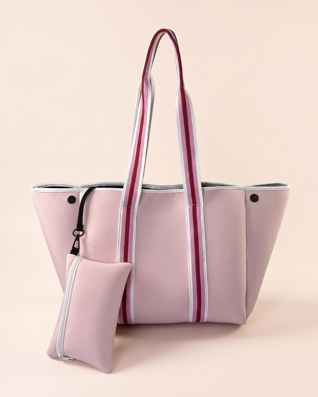 Pink neoprene tote bag with striped handles